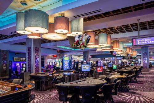 a casino with a bunch of machines and tables at Harrah's Gulf Coast, A Caesars Destination in Biloxi