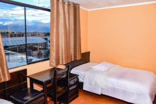 Ένα ή περισσότερα κρεβάτια σε δωμάτιο στο Hotel Santa Ana