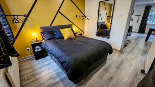 a bedroom with a large bed in a room at Modern City Centre Apartment in Belfast