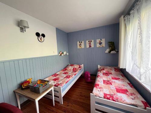 Una cama o camas en una habitación de A&R Brzozowa 5