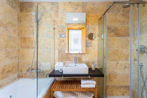 a bathroom with a sink and a shower at Sunny Home in Benalmádena