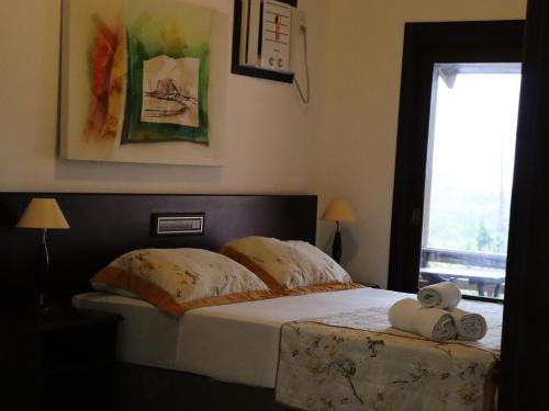 Ένα ή περισσότερα κρεβάτια σε δωμάτιο στο Guarita Park Hotel - By Life Hotéis