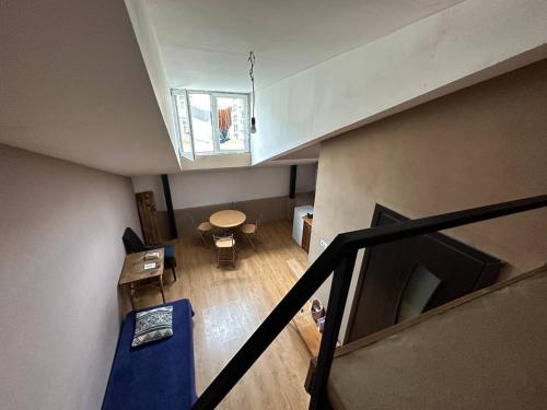 an overhead view of a living room with a table and a staircase at Graz Narek house 4 in Altenfelden