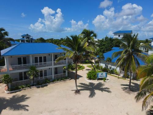 an aerial view of a resort with palm trees at Sapphire Beach Resort in San Pedro