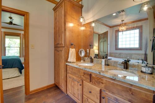 a bathroom with two sinks and a large mirror at Pool Access, Deck and Boat Slip Monkey Island Oasis in Monkey Island