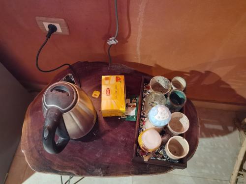 a table with a tea pot and other items on it at Studio house in Tunis