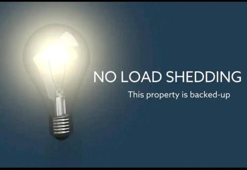 a light bulb with the words no load shedding at La Ballito 202 in Ballito