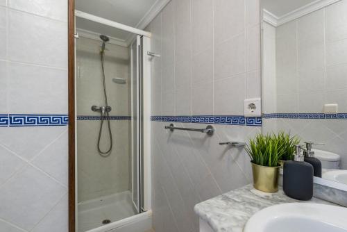 a bathroom with a shower and a sink at Villa Rodrigo - PlusHolidays in Benissa