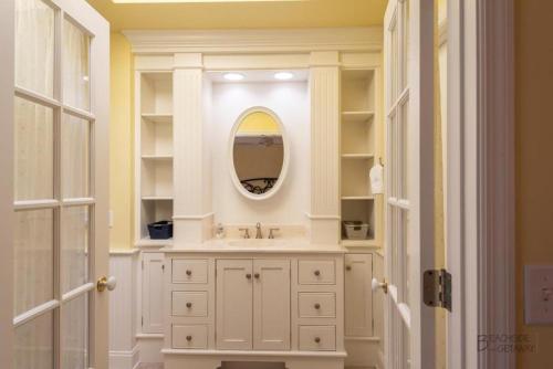 a bathroom with a sink and a mirror at 12 Isle of Pines in Hilton Head Island