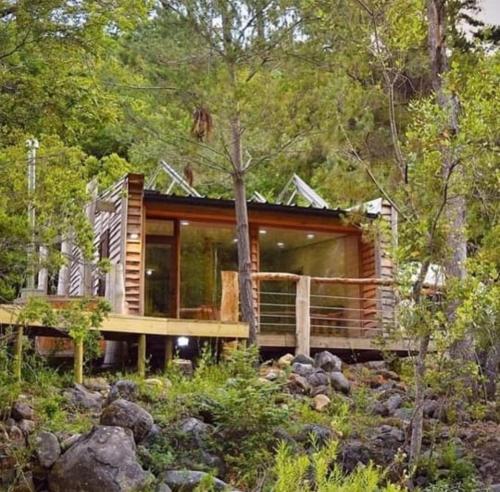 a house in the middle of the forest at Domos Altos de Lircay in San Clemente