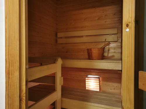 a wooden cabin with a bunk bed in it at Rovaniemi Cityhome Sunnarborg in Rovaniemi