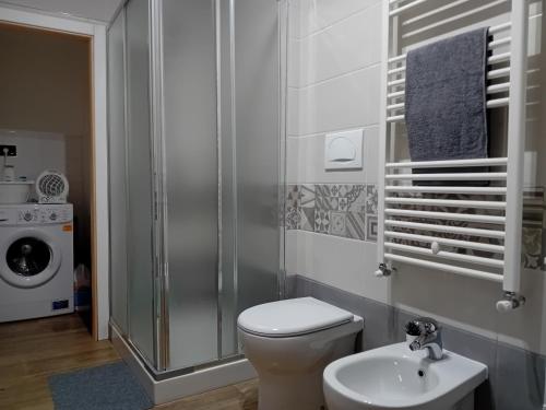 a bathroom with a toilet and a sink at Villa Nonno Nicola in Montenero di Bisaccia