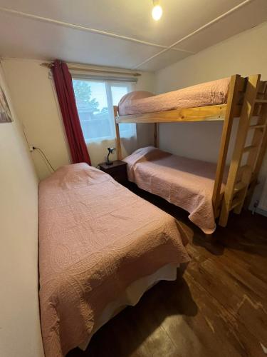 Llit o llits en una habitació de Cabañas LUPA