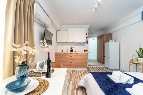 a bedroom with a table with a blue bowl on it at Praia da Rocha Beach Bright Apartment 50 m walk from the ocean in Portimão