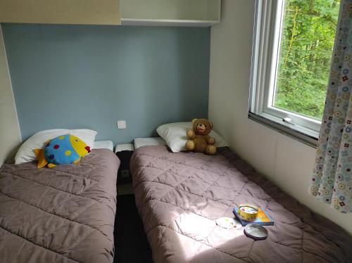 Katil atau katil-katil dalam bilik di Camping le Rouge Gorge **** 10' Puy du Fou