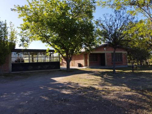 a brick building with a tree in front of it at Casa San Lucas in San Rafael