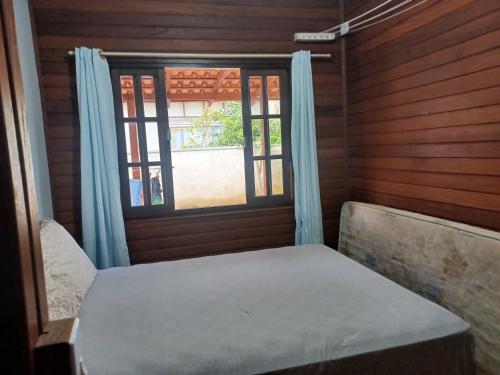 Ένα ή περισσότερα κρεβάτια σε δωμάτιο στο Casa Barra do Sai