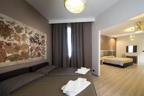 Hotel Tirrenoにあるベッド
