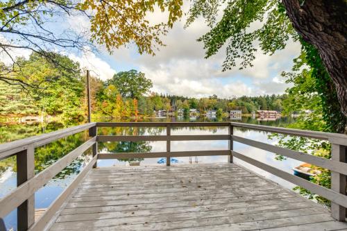 a wooden bridge over a body of water at Horseshoe Lake Vacation Rental with Deck and Kayaks! in Batavia