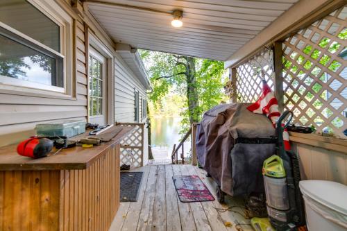 an inside view of a tiny house with a porch at Horseshoe Lake Vacation Rental with Deck and Kayaks! in Batavia