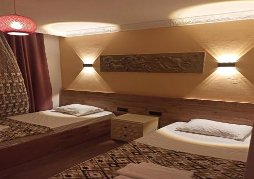 מיטה או מיטות בחדר ב-Agon Boutique Hotel