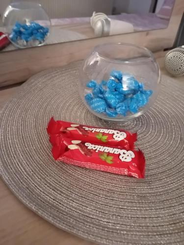 a bag of blue candy sitting on a table at Apartman Park Kragujevac in Kragujevac