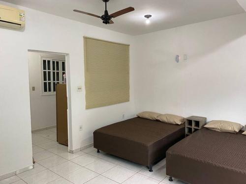 Cama o camas de una habitación en Triplex Praia Brava