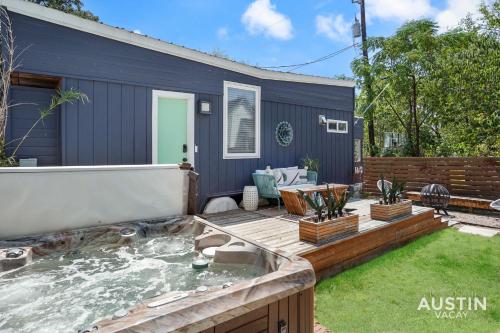 a backyard with a jacuzzi in the yard at HGTV Featured Tiny Home w Hot Tub Near East 6th St in Austin
