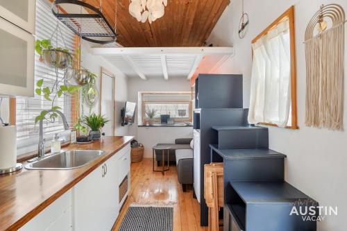 a kitchen with a sink and a counter top at HGTV Featured Tiny Home w Hot Tub Near East 6th St in Austin