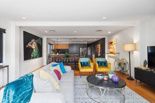 a living room with a couch and a table at Artscape, Newtown Villa in Sydney