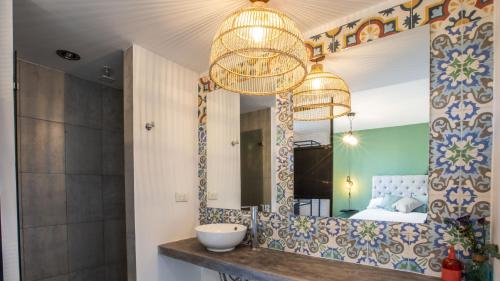 a bathroom with a sink and a mirror at 103 Wonderful House in Bogotá