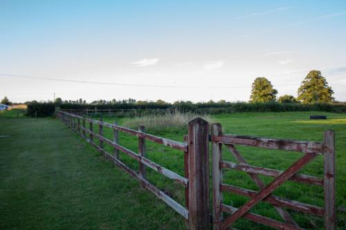 a wooden fence in the middle of a field at Stourport Manor Hotel in Stourport