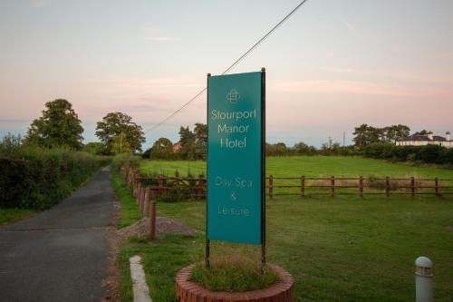 a sign for a water hotel on the side of a road at Stourport Manor Hotel in Stourport