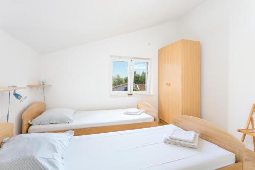 Voodi või voodid majutusasutuse Apartment Seget Vranjica 14409a toas