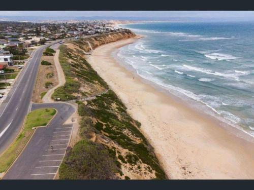 an aerial view of a beach next to the ocean at Laidback Seaford Family Retreat 200m from Beach in Adelaide