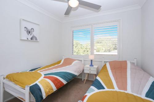 En eller flere senge i et værelse på Moola Palms