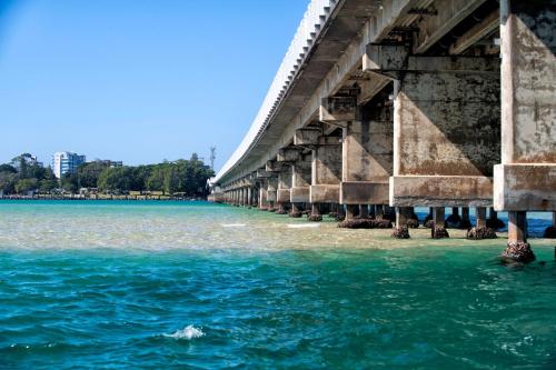 a bridge over a body of water at Tokelau Townhouse 1 in Tuncurry