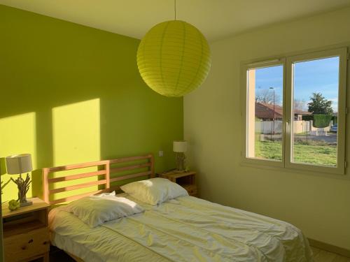 a bedroom with a bed and a large window at Maison 6 pers, climatisée, quartier calme, proche Dune du Pyla et pistes cyclables, ménage inclus - FR-1-319-426 in Parentis-en-Born