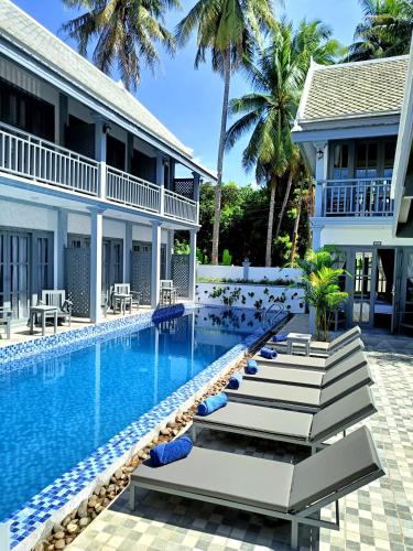 an image of a swimming pool at a resort at LuangPrabang Pearl Hotel in Luang Prabang