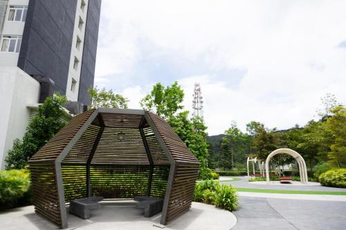 a bird cage in front of a building at Windmill Upon Hills Premium Suite By Rapi Stay in Genting Highlands