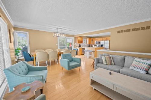a living room with a couch and chairs and a table at 120 Creel Home away from Home for 22 at the Lake in Linn Creek