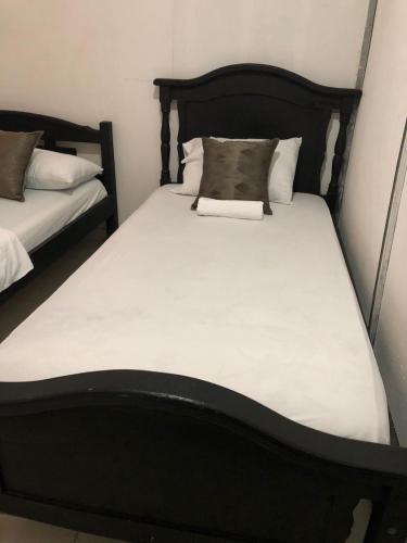 Cama o camas de una habitación en Hostal Mía Apá