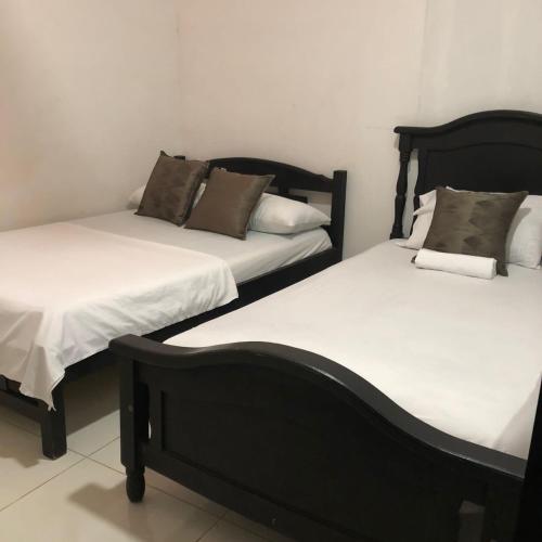 Cama o camas de una habitación en Hostal Mía Apá