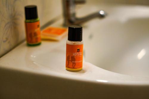 a bottle of iodine sitting on a bathroom sink at Hotstel Udaipur in Udaipur