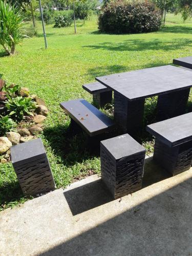 a picnic table and benches in a park at My Home @ Wang Yao in Ban Tha Sai (1)