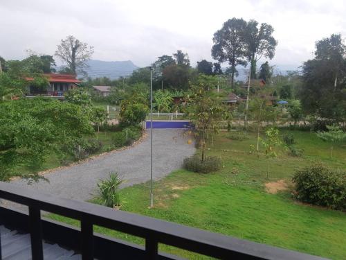 a view of a park from a balcony at My Home @ Wang Yao in Ban Tha Sai (1)
