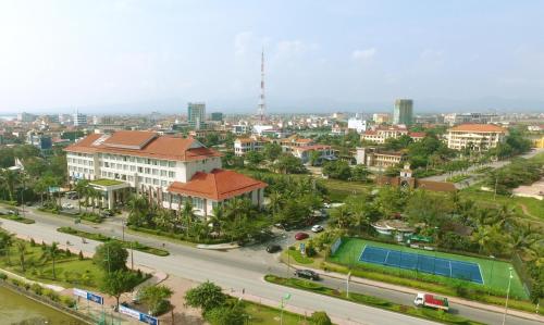 an aerial view of a city with a street and buildings at Sai Gon Quang Binh Hotel in Dong Hoi