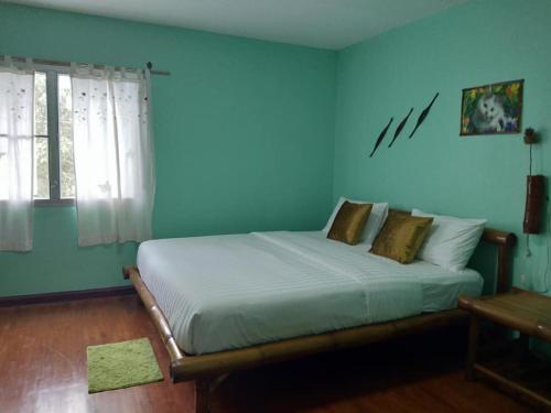Кровать или кровати в номере Green Home