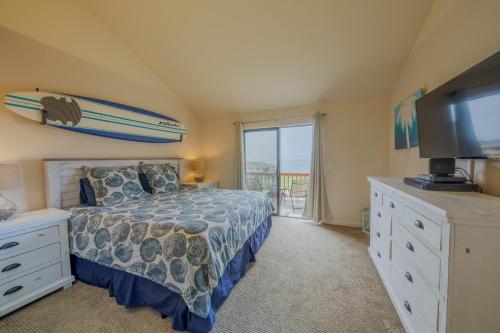 a bedroom with a bed and a surfboard on the wall at Seascape Ocean View Condo in Aptos