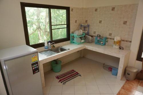 a small kitchen with a counter and a sink at Klang Dong Mountain View - Khao Yai in Klang Dong